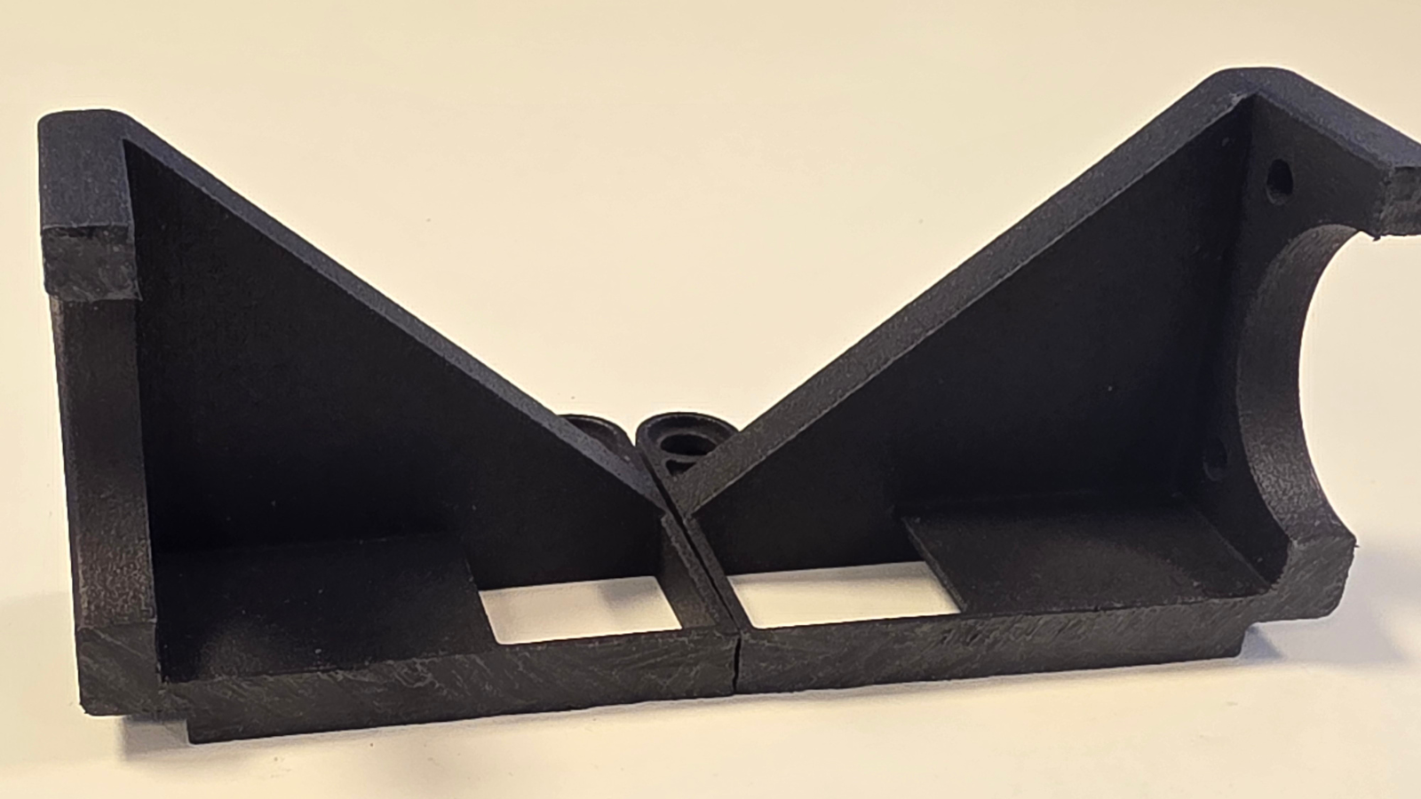 Black dyed 3D printed bracket cut in half